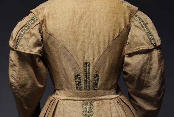 Close-up of embroidered back detail on a vintage 19th-century dress, from Australia’s most visited outdoor museum and heritage attraction.